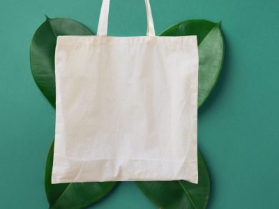 Blank,White,Mockup,Linen,Cotton,Tote,Bag,On,Green,Leaves